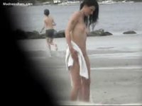 Hidden voyeur cam on the beach video compilation capturing nude tanners
